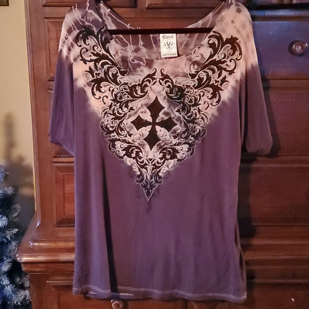 Vocal dolman sleeve top.